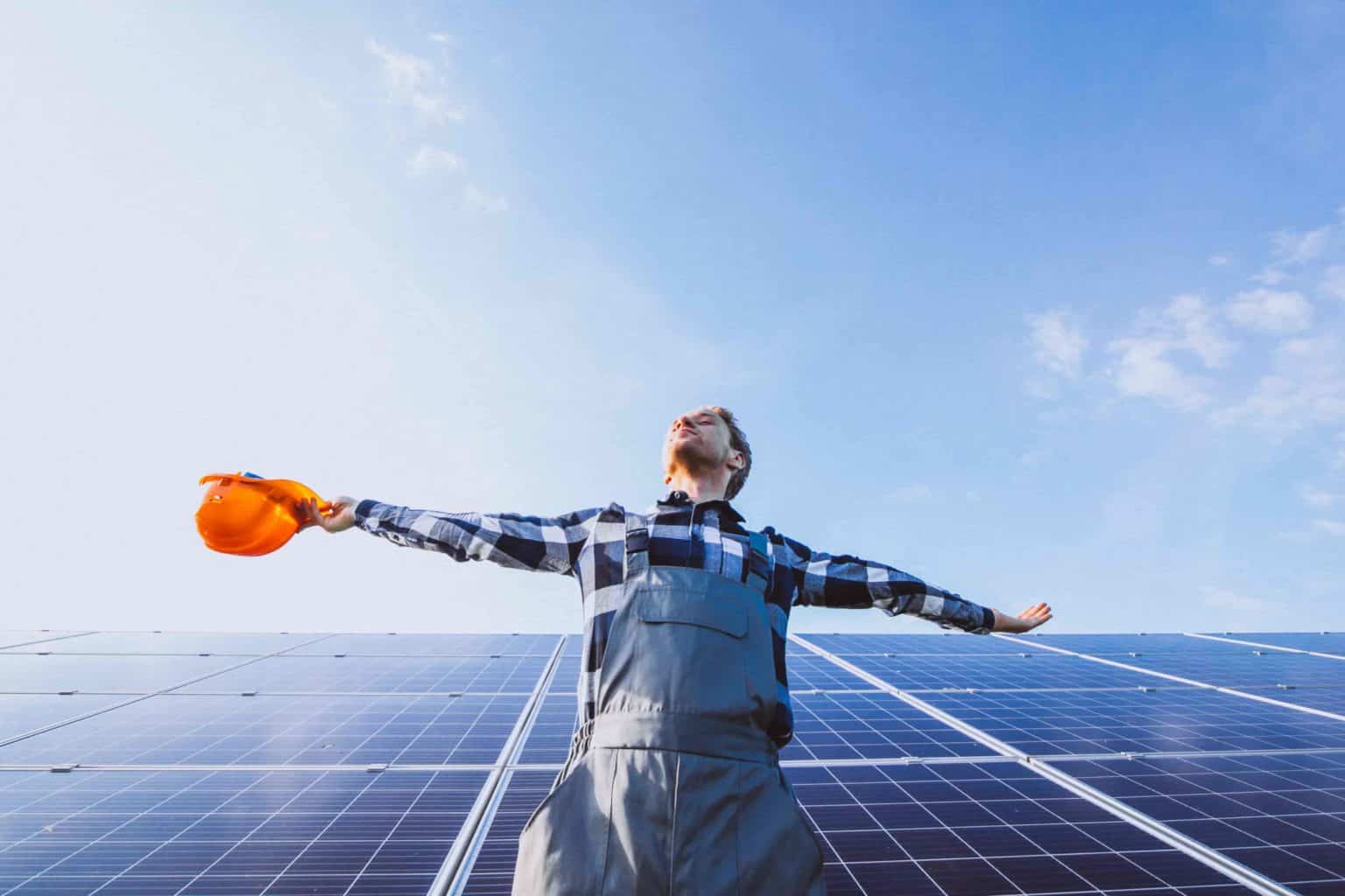 man worker in the firld by the solar panels 1 1536x1024 1 1